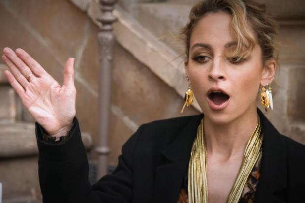 Nicole Richie smacked in face when high-five goes wrong during awkward interview