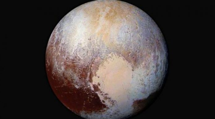 NASA research reveals liquid water below icy surface of Pluto