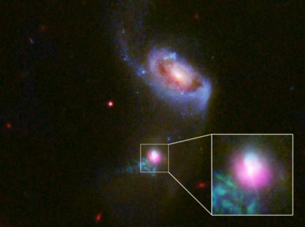 Scientists catch supermassive black hole burping - twice