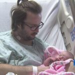 John Lancaster wakes up from coma to meet his firstborn baby John Lancaster wakes up from coma to meet his firstborn baby