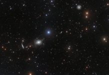 Tech: Elliptical elegance in glittering host of galaxies — (Report)
