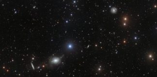 Tech: Elliptical elegance in glittering host of galaxies — (Report)