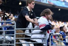 Giants fan: Saints Fan Helping Disabled Fan Stand (Picture) Giants fan: Saints Fan Helping Disabled Fan Stand (Picture)